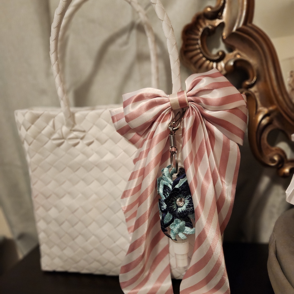 Elegant White Woven Bag with Pink Ribbon Accent